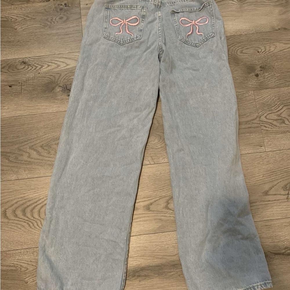 Women's Light Blue Jeans with Pink Bow Accents